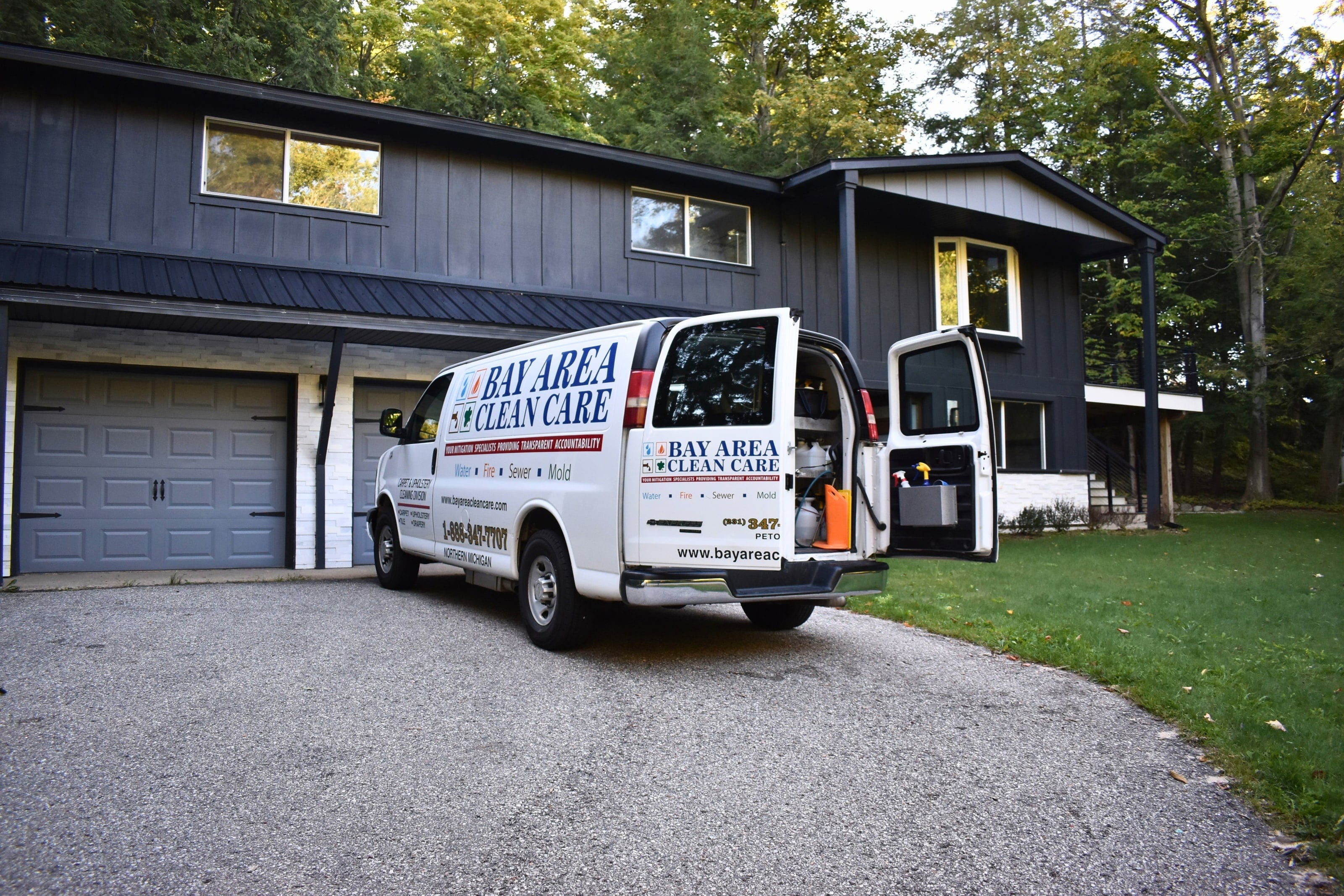 The Bay Area Clean Care carpet cleaning van parked in the driveway of a client's home